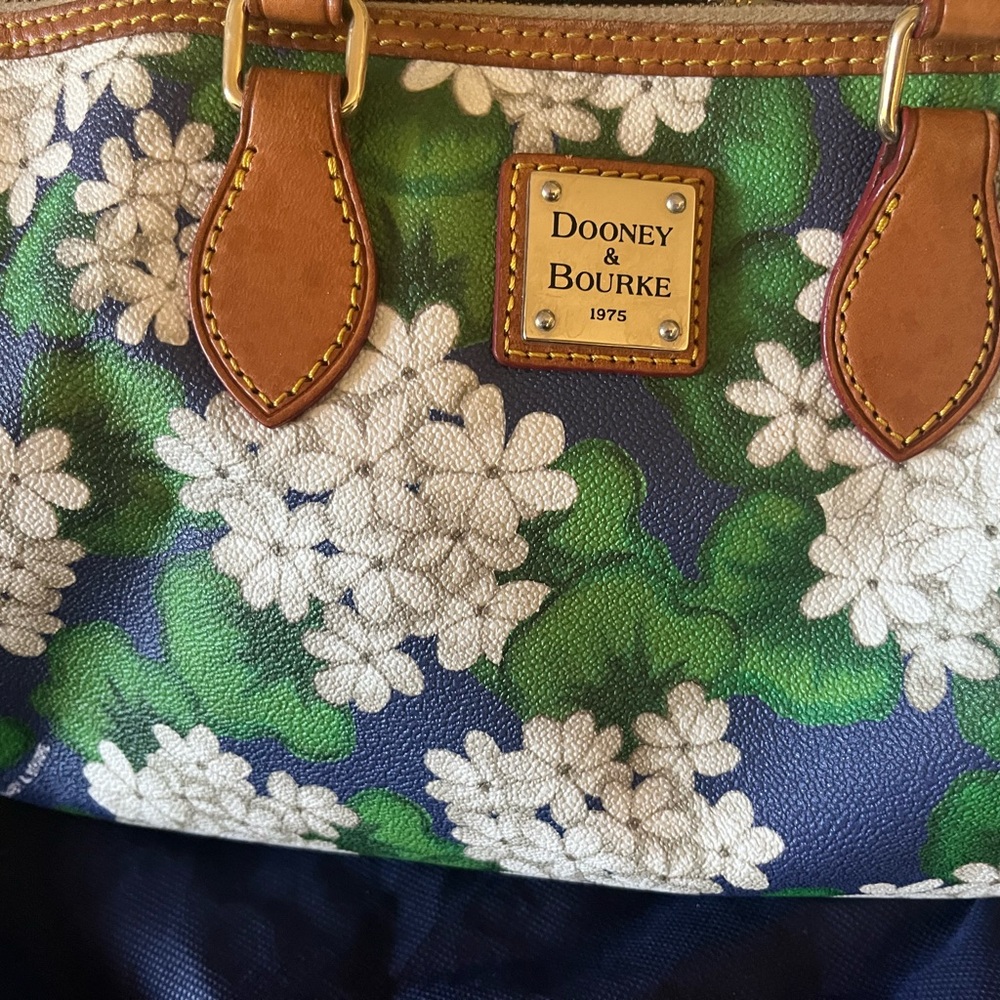 Dooney & Bouke coated Cotton floral printed Satchel in pre-owned condition.